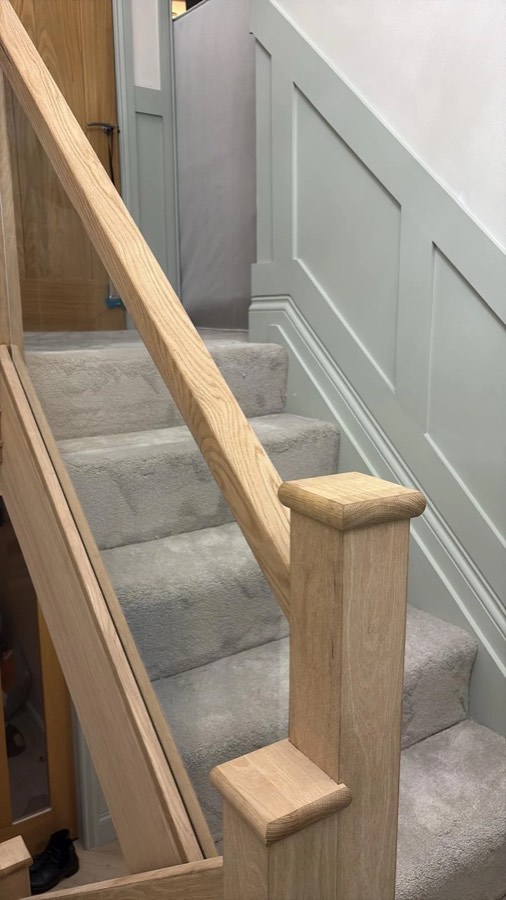 A & R Flooring job — grey carpet fitted on stairs with oak handrail